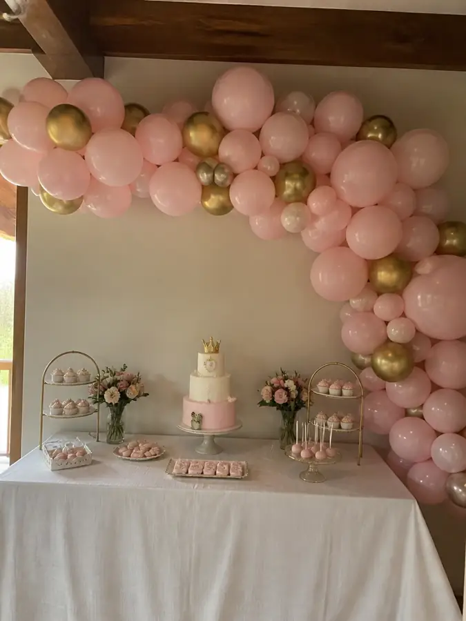 Balloon garland over a dessert table