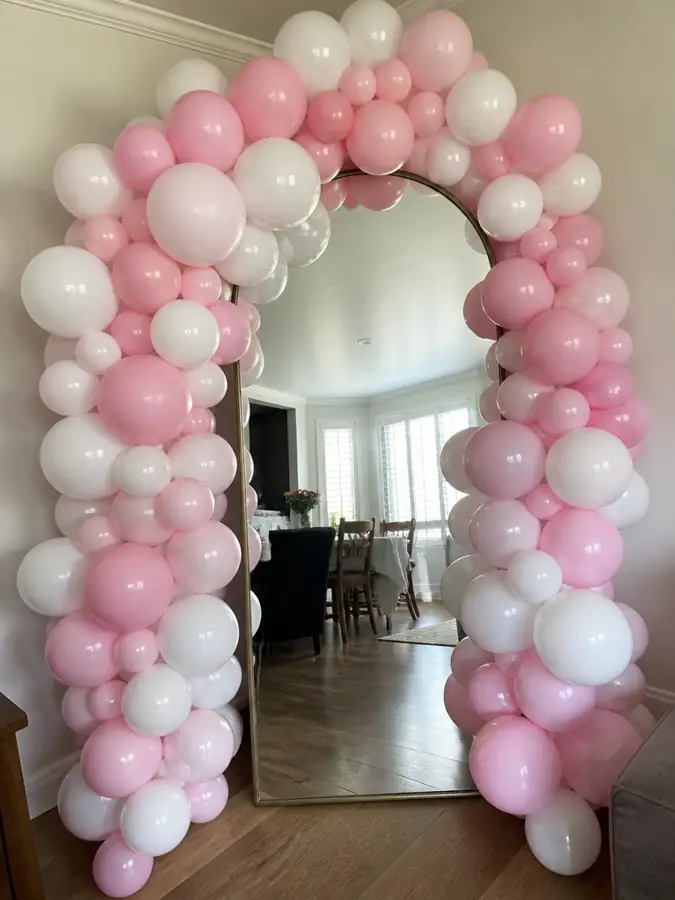 Balloon garland around a mirror