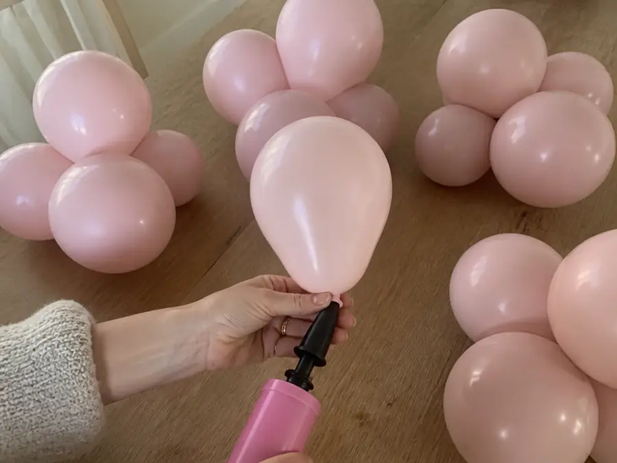 Inflating balloons with a hand pump